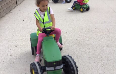 nursery child driving tractor