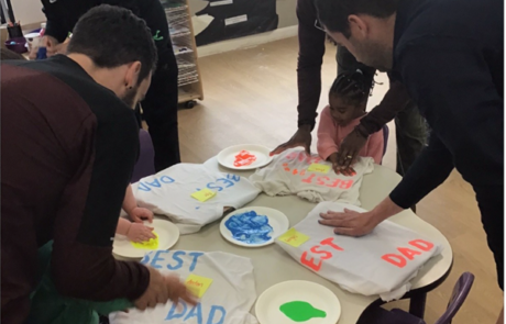 Dad's helping to make their t-shirts