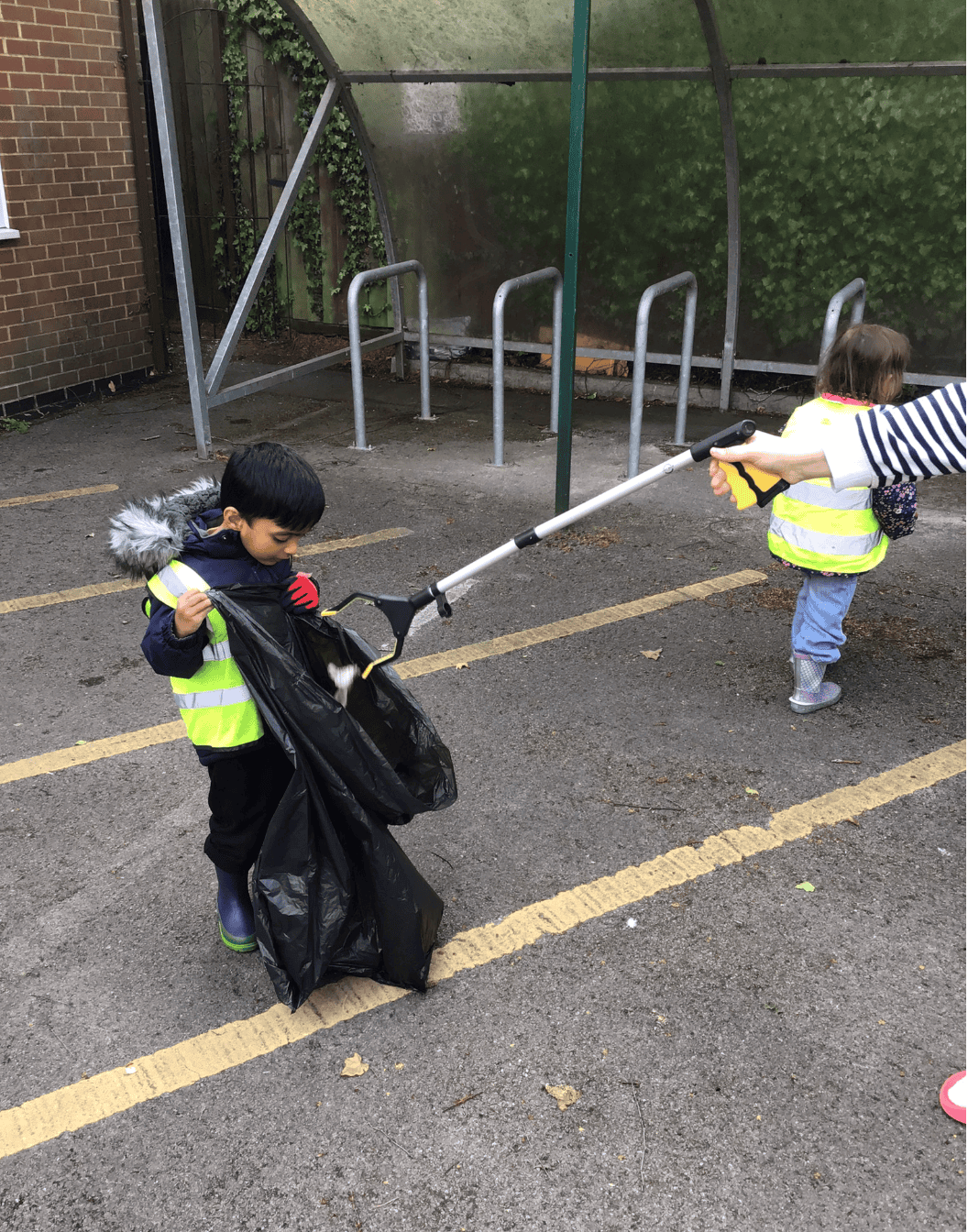 Preschooler litter picking