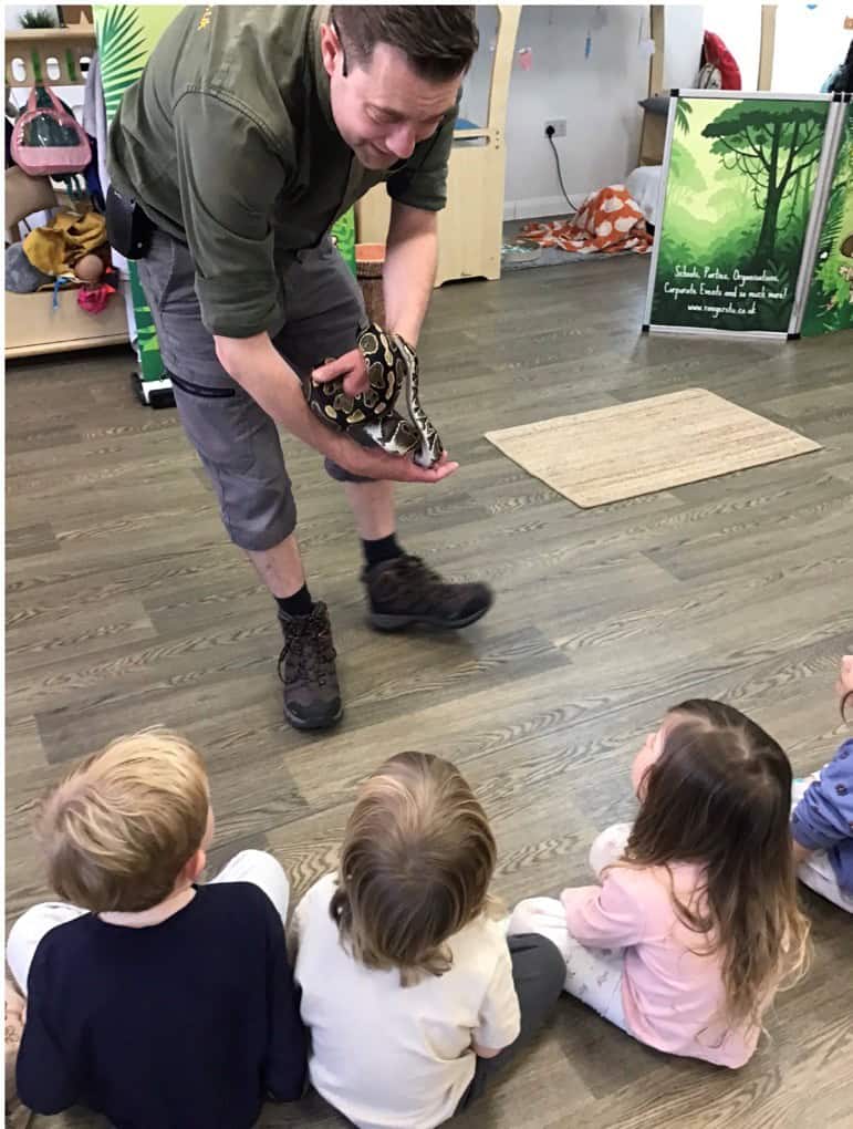 Ranger Stu showing children a snake