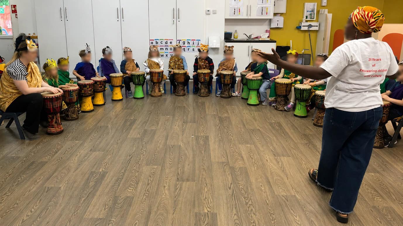 Group of children playing the African drums