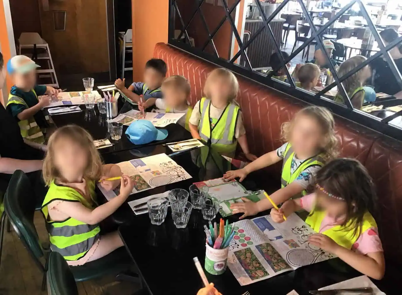 Nursery children doing colouring in at Pizza Express